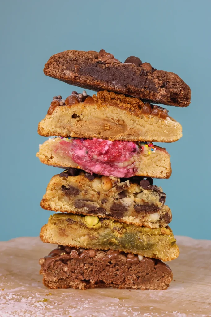 Stack of freshly baked Ganache cookies in assorted flavors